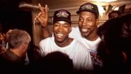 Thomas celebrating the Pistons' 1990 NBA Finals with Vinnie Johnson.